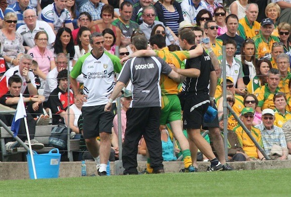 Jim Mc Guinness can hardly believe it as Donegal suffer the first major blow of the contest when Mark Mc Hugh was forced to leave the field after sustaining an injury in the opening exchanges. Pic.: Gary Foy
