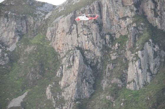 The rescue 118 helicopter winches the woman to safety at Sliabh League. Pic courtesy of Norman Miller.