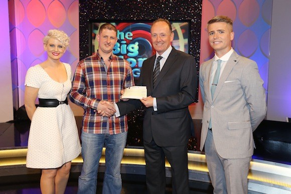 Trevor Curran from Speenoge, Burt, Co. Donegal has won €74,050 including a holiday to Greece on last Saturday’s (29th June 2013) National Lottery Big Money Game Show on RTE.  Pictured at the presentation of cheques were from left: Sinead Kennedy, Big Money Game Show host; Trevor Curran, the winning player; Declan Harrington, Head of Finance, The National Lottery and Brian Ormond, game show host. The winning ticket was purchased from XL Dunleavey’s, Ardglass Crossroads, Portsalon, Letterkenny, Co. Donegal. Pic Mac Innes Photography