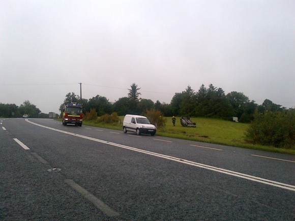 The woman's car skidded and flipped into a field