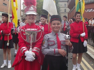 The band show off their cup