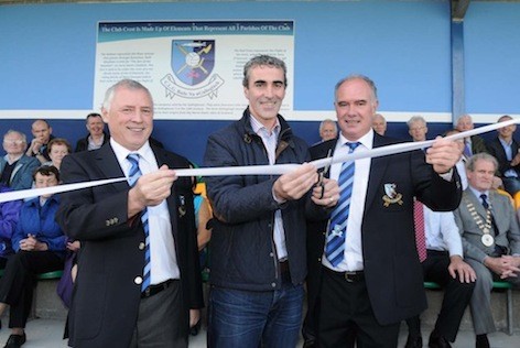 Jim McGuinness cuts the tape to officially open the new stand at the Milford GAA Club on Saturday evening with club officials Pat Curley and Fergus Friel.