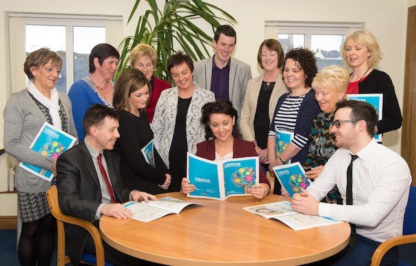 Members of the Donegal County Childcare group viewing the research document.