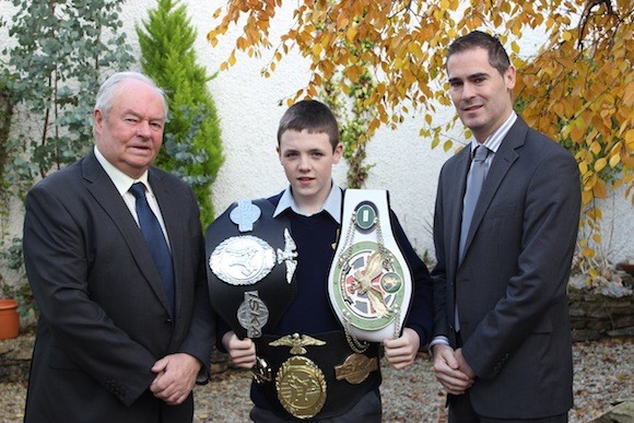 Principal Mr PJ McGowan and Vice Principal Mr Danny McFadden congratulate Damien on his magnificent win