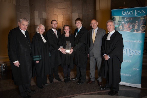 Winners of Breágchúirt Uí Dhálaigh 2013, the annual Irish language moot court organized by Gael Linn for law students, from UCD ( centre, l-r ) Simon Mac Giolla Easpaig, Aoibhinn Nic Cionnaith and Peadar Ó Lamhna along with ( from left ) Séamus Ó Tuathail, S.C., Supreme Court Judge, The Honourable Mary Laffoy, Gael Linn CEO, Antoine Ó Coileáin and High Court Judge,The Honourable Colm Mac Eochaidh.
