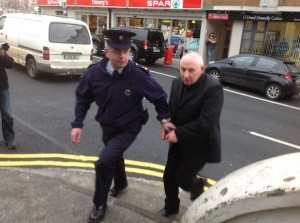 Michael Ferry, right, being taken into court in Donegal Town in December.