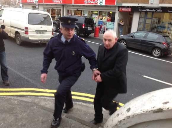Michael Ferry, right, being taken into court in Donegal Town today