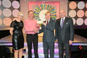 Frank McDaid from Moville, Co. Donegal won €58,000 on the National Lottery Winning Streak Game Show on RTE, on the 7 February 2014. Pictured at the presentation of winning cheques were, from left to right: Sinead Kennedy, game show co-host; Frank McDaid, the winning player; Eddie Banville, Head of Marketing, The National Lottery and Marty Whelan, game show co-host. The winning ticket was bought from EuroSpar, Newtowncunningham, Co. Donegal. Pic: Mac Innes Photography