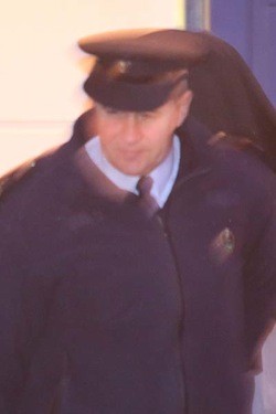 Christopher Orr being led away (covered) after sentencing at Letterkenny Court.  (NewspixIrl)