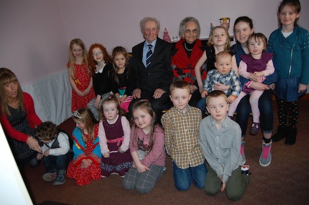 John and Bridget celebrate with their great grandchildren and grandaughter Muriel. 