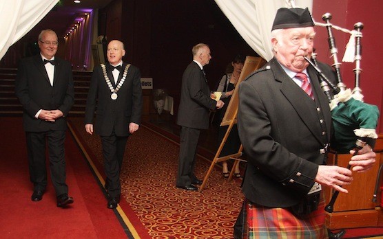 A piper leads Donegal Person of the Year Liam O Cuinneagain and Martin Mc Gettigan, President, Donegal Person of the Year, into the award function in Dublin on Saturday night.