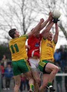Christy Toye and Leon Thompson go high to win this ball in the game in Ballyshannon on Sunday against Louth. Photo Brian McDaid