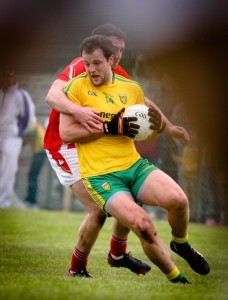 Michael Murphy keeps possession against Louth: Pic Brian McDaid
