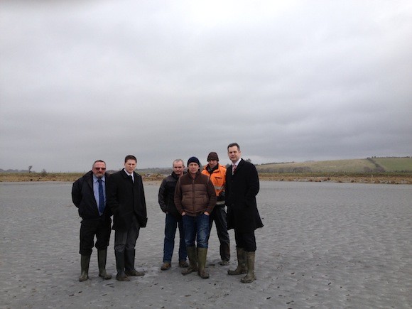 No 2 - Picture of Matt Carthy, Pearse Doherty and John Sheamais O'Fearraigh with Local Farmers in field covered in sand as a result of flooding  