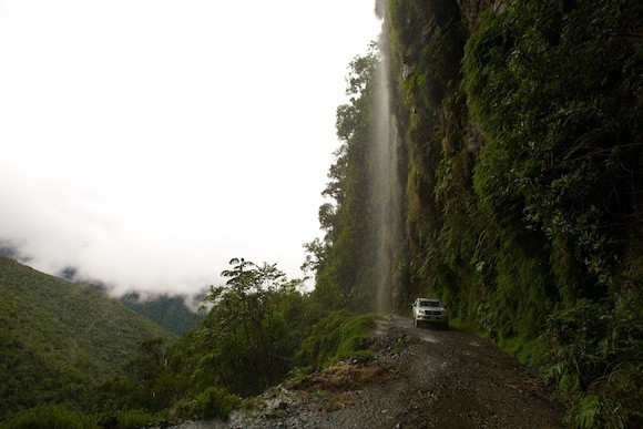 The lads travel beneath a waterfall in their Toyota given to them by Kellys.