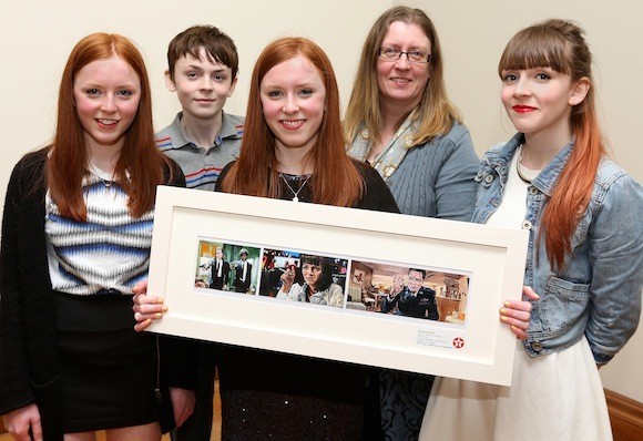 Cáitríona McClay (16), a student at Loreto Community School, Milford is a winner in this year's 60th Texaco Children's Art Competition. She is pictured with her prize-winning painting entitled ‘Pulp Fiction’, with her twin sister Eimear, brother Eamonn, mother Deirdre and sister Éilís. The picture was taken at a function to announce the top winners held in the Dublin City Hugh Lane Gallery.