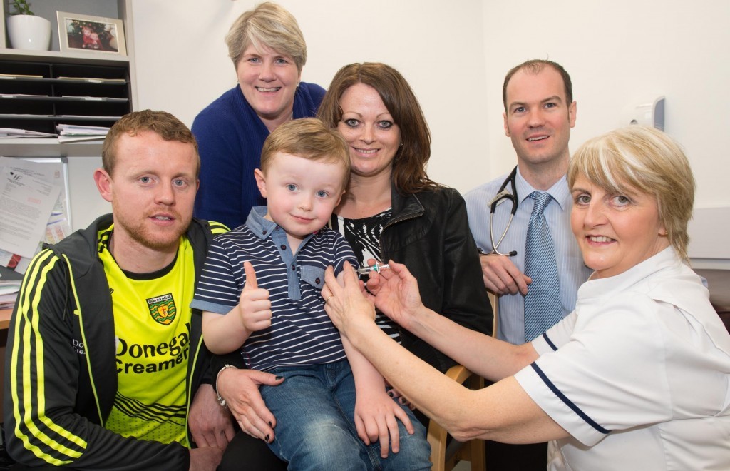 Charlie McHale with his mum Mary Rose Carr as he gets his pre school booster from Practice Nurse Ursula Molloy, with Gary McFadden, Donegal County Senior Football Player; Bernie McNulty, Assistant Director Public Health Nursing for Immunisation in Donegal and GP Dr. Eamon Coyle.