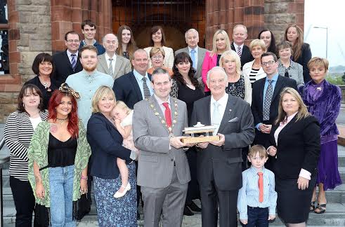 Mayor Reilly awards Dr Tom McGinley his award surrounded by family and friends.