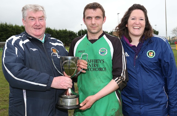 Donegal Junior League Administrator Terry Leyden pictured presenting the Downtown Cup to Tommy Rodgers captain of Glenea United Reserves. Included is League Secretary Christina O' Donnell. Pic.: Gary Foy, League PRO