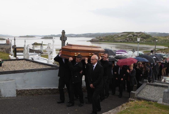 Julia's remains are brought to the church today with her native Owey island in the background. Picture by Joe Boland.