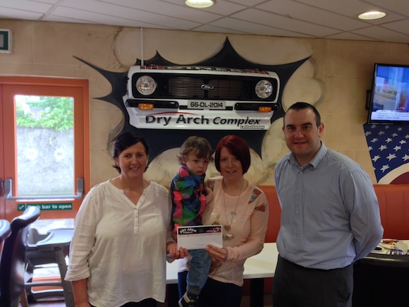 Jackie Gallagher and her son winners of the dry arch holiday in the sun competition being presented with their prise by Yvonne brogan and Damien mc cormack store manager 