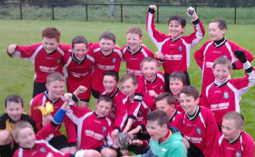 We've done it! A wet but delighted Glencar Hammers team celebrate after they overcame Letterkenny Crusaders in the Letterkenny and District Under 12 Reserve Cup Final at Leckview Park tonight. Two goals by Sean McGinley topped off what was a great team display by the Hammers who managed to hang on as League Champions came strong in the end. Congrats to coaches Martin Hunter and John McGinley who trained the lads all season.