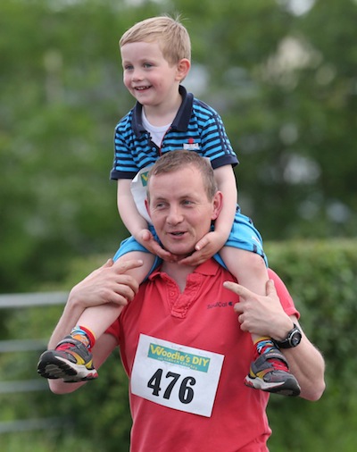 Former Twin Towns Lord Mayor Barry Dowds has a passenger for good measure as he takes part in the Sessiaghoneill NS 5K Fun Run & Walk. Pic.: Gary Foy, newsandsportfiles