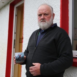 Patrick McLaughlin holds a picture of his youngest son Enda at his home in Glentogher. Pic Copyright Northwest Newspix