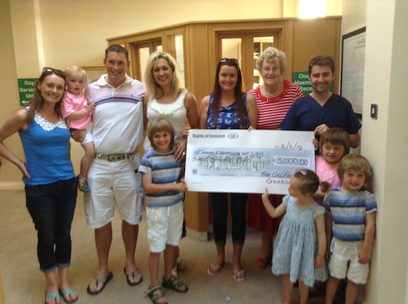 The Coll family present the cheque to the Oncology Unit at LGH.