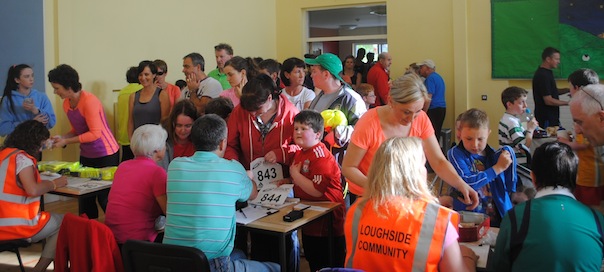 Some of the huge crowd begin to register for the Loughside Community 5K.