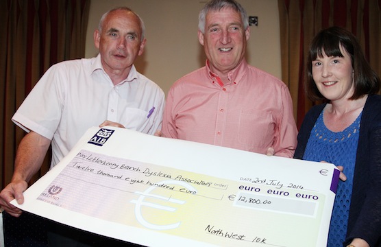 Mick Lagan and Treasa Mc Fadden receive €12,800 forLetterkenny Branch of Dyslexia Association from James Boyle, Chairman of the Northwest 10k Committee. Photo Cristeph/Brian Mc Daid