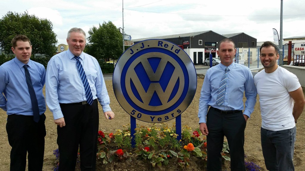 Donegal star Karl Lacey posing with staff from J.J Reid Motors. 