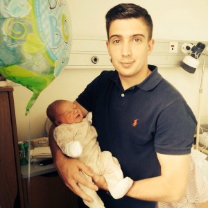 Proud dad Shaun Kelly holding his son Luca who was born last week. 