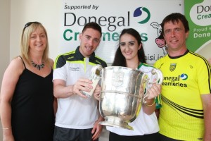 Bridgid Mc Dyre winner of the Donegal's best supporter pictured with Donegal's Martin Reilly and Asst Donegal Manager John Duffy pictured as they celebrate with the Anglo Celt Cup when they met up at Principal Sponsor Donegal Creameries Headquarters at the Crossroad,  Killygordan. The are pictured with Donegal Creameries representative  Breege Linsay Photo Cristeph/Brian McDaid