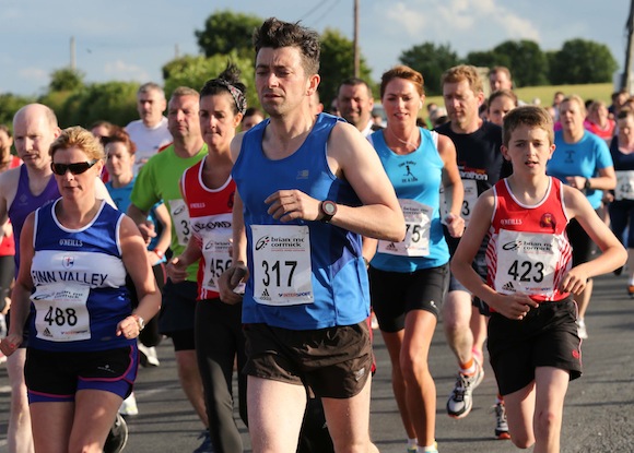 Andrew Leighton (317) leads this group as they set off to tackle the St. Johnston 5K Road Race. Pic.: Gary Foy