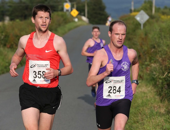 St. Johnston 5K Race winner Adrian Mc Gowan of Foyle Valley AC turns for home with 2nd placed Gary Slevin of City of Derry Spartans on his shoulder and 3rd placed Stephen Connor not too far behind. Pic.: Gary Foy
