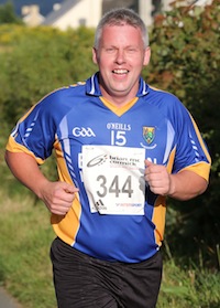 Kieran Neeson enjoying the run as he enters the closing stages of the St. Johnston 5K Road Race. Pic.: Gary Foy