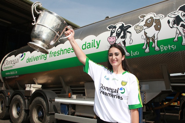 Bridgid Mc Dyre winner of the Donegal's best supporter pictured with Donegal Creameries Headquarters at Crossroads Killygordan with the Anglo Celt Cup. Photo Cristeph/Brian McDaid