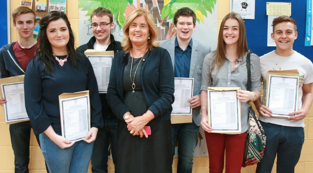 Crana College teacher Mary Galbraith pictured with her Leaving Cert Irish class after they received their excellent results.