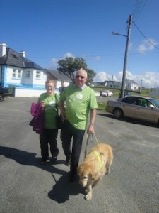 Well known Tory resident Jimmy Doohan with wife Theresa and his loyal guide dog. 