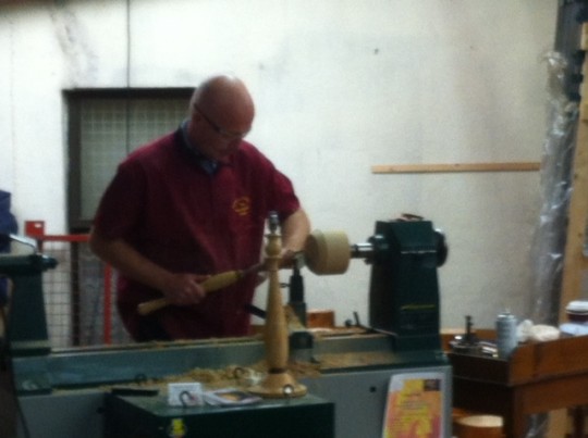 Robert O'Connor demonstrating expert woodturning today at the exhibition at W.H. Raitt.
