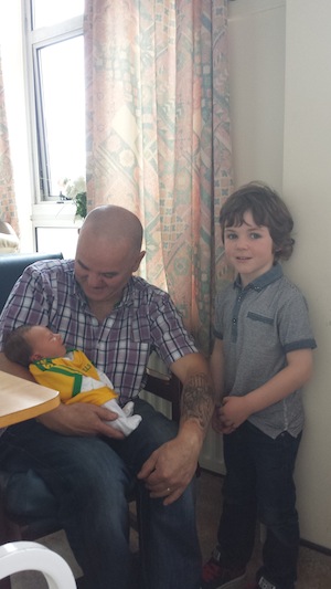 Baby Daithi is spoiled by his grandfather Brian Grant and cousin Oisin Higgins