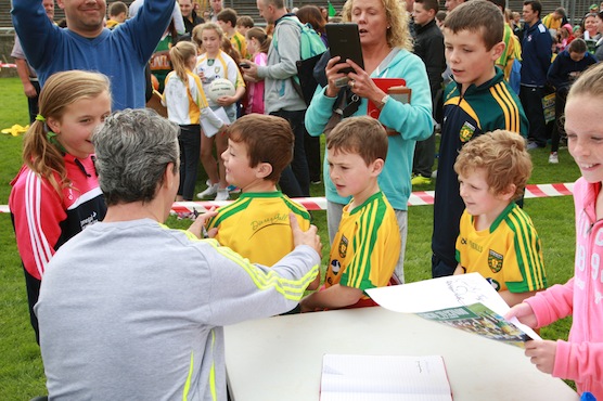 Donegal Manager Jim Mc Guinness signs some new players at the fans day in Ballybofey. Photo Brian McDaid