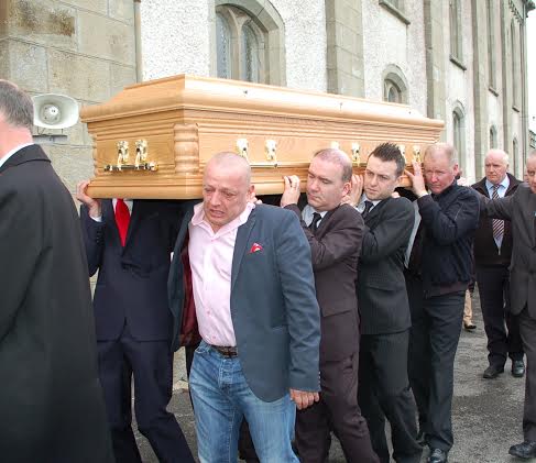 The remains enter the Church carried by Marcus White, Paul Kennedy, David Giblin and Edward Gilligan