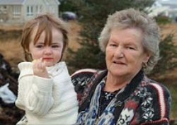 Ann Boyle with one of her grandchildren. Pic courtesy of RTE.