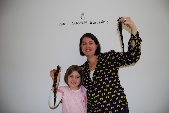 Aoife and Roisin with a new look and their donated hair!