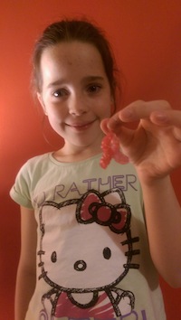 Aine with one of her pink ribbon loom bands.