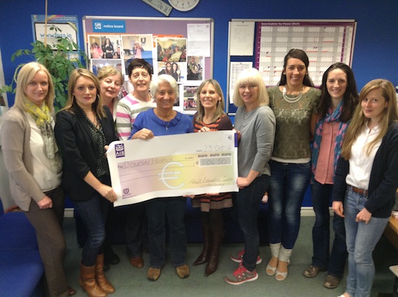 Staff present a cheque to Grace Boyle of the Donegal Hospice.