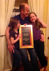 Proud Derek shows off his award to his children