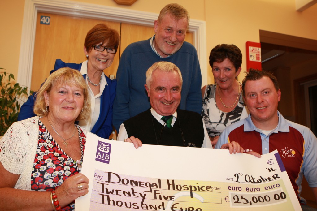 John J Mc Gettigan, Vincent and Brigid O Rourke, present a cheque for Û25,000 proceeds of a cycle in memory on their son Vinnie, they are pictured with Annette Cunningham and Geraldine Casey and Dr James McDaid from the Donegal Hospice . Photo Brian McDaid/ Cristeph